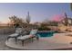 Charming pool with lounge chairs, desert landscaping and mature cacti create a relaxing desert oasis at 7735 E Russell Cir, Mesa, AZ 85207