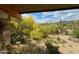 Scenic backyard view with desert landscape, saguaro cactus, and mountains in the distance at 7915 E Primrose Path, Carefree, AZ 85377
