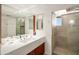 Modern bathroom with a walk-in shower and double vanity at 7915 E Primrose Path, Carefree, AZ 85377