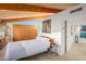 Mid-century modern bedroom with wood accents and large window at 7915 E Primrose Path, Carefree, AZ 85377