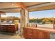 Mid-century bedroom with stone accents and mountain views at 7915 E Primrose Path, Carefree, AZ 85377