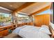 Bright bedroom with built-in shelves and stone accents at 7915 E Primrose Path, Carefree, AZ 85377