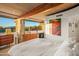 Mid-century bedroom with stone wall and large window at 7915 E Primrose Path, Carefree, AZ 85377