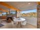 Bright dining area with a round table and chairs, offering scenic views at 7915 E Primrose Path, Carefree, AZ 85377