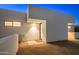 Modern home's exterior entrance with desert landscape at 7915 E Primrose Path, Carefree, AZ 85377