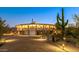 Stunning circular home with desert landscaping, at dusk at 7915 E Primrose Path, Carefree, AZ 85377