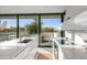 Modern kitchen with white cabinets, stainless steel appliances, and a view at 7915 E Primrose Path, Carefree, AZ 85377