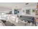 Modern kitchen with island and bar stools, open to living area at 7915 E Primrose Path, Carefree, AZ 85377