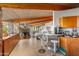 Modern kitchen with a breakfast bar and wood cabinetry at 7915 E Primrose Path, Carefree, AZ 85377