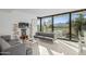 Modern living room with glass doors and mountain views at 7915 E Primrose Path, Carefree, AZ 85377