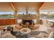Large stone fireplace, open floor plan, mountain view at 7915 E Primrose Path, Carefree, AZ 85377