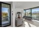 Modern living room with glass doors and mountain views at 7915 E Primrose Path, Carefree, AZ 85377