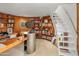 Circular home office with built-in shelves and a spiral staircase at 7915 E Primrose Path, Carefree, AZ 85377