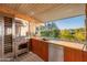 Outdoor kitchen features stunning views and modern appliances at 7915 E Primrose Path, Carefree, AZ 85377