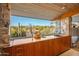 Outdoor kitchen with a sink, cabinetry, and panoramic views at 7915 E Primrose Path, Carefree, AZ 85377