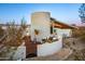 Outdoor grilling area and curved seating wall at 7915 E Primrose Path, Carefree, AZ 85377
