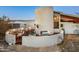 Outdoor patio with built-in grill and seating area at 7915 E Primrose Path, Carefree, AZ 85377