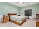 Spacious bedroom with wood furniture and large window at 830 E Tortoise Trl, San Tan Valley, AZ 85143