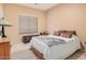 Guest bedroom with queen-size bed and ample closet space at 830 E Tortoise Trl, San Tan Valley, AZ 85143