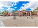 House exterior with a red truck parked in the driveway at 830 E Tortoise Trl, San Tan Valley, AZ 85143