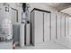 Garage with water softener and storage cabinets at 830 E Tortoise Trl, San Tan Valley, AZ 85143