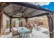 Covered patio with seating area, perfect for outdoor dining at 830 E Tortoise Trl, San Tan Valley, AZ 85143