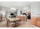 Open kitchen with island and breakfast bar, overlooks dining area at 830 E Tortoise Trl, San Tan Valley, AZ 85143