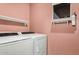Convenient laundry room with washer and dryer hookups at 830 E Tortoise Trl, San Tan Valley, AZ 85143