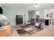 Relaxing living room featuring comfy armchairs and a stylish rug at 830 E Tortoise Trl, San Tan Valley, AZ 85143