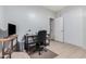 Bright home office with a desk and comfortable chair at 830 E Tortoise Trl, San Tan Valley, AZ 85143