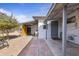 Private backyard features brick pavers, mature trees, and a covered patio area at 9410 N 4Th Ave, Phoenix, AZ 85021