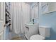 Stylish bathroom featuring a modern vessel sink, updated fixtures, and bright blue walls at 9410 N 4Th Ave, Phoenix, AZ 85021