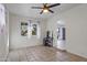 Spacious bedroom with tile flooring, ceiling fan, and natural light; perfect for personalization at 9410 N 4Th Ave, Phoenix, AZ 85021