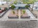 Aerial view of charming home featuring rock-lined yard, mature landscaping, and expansive driveway at 9410 N 4Th Ave, Phoenix, AZ 85021