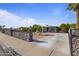 Inviting home with mature landscaping, privacy rock wall, and expansive driveway on a sunny day at 9410 N 4Th Ave, Phoenix, AZ 85021