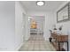 Bright hallway features tile flooring, and a view of the dining room; homey and spacious at 9410 N 4Th Ave, Phoenix, AZ 85021