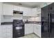 Bright kitchen with white cabinets, black appliances, tiled backsplash at 9410 N 4Th Ave, Phoenix, AZ 85021