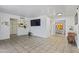 Spacious living room featuring tile flooring, a large mounted television, and neutral paint at 9410 N 4Th Ave, Phoenix, AZ 85021