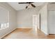This primary bedroom has tall ceilings and a ceiling fan at 955 E Vaughn Ave, Gilbert, AZ 85234