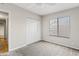 Cozy bedroom featuring a ceiling fan, closet, and a window at 955 E Vaughn Ave, Gilbert, AZ 85234