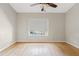 This airy bedroom offers ample natural light and a ceiling fan at 955 E Vaughn Ave, Gilbert, AZ 85234