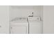 Efficient laundry area featuring a washer and dryer, maximizing convenience at 955 E Vaughn Ave, Gilbert, AZ 85234