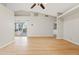 Bright living room featuring hardwood floors, an enclosed patio, and bright walls at 955 E Vaughn Ave, Gilbert, AZ 85234