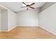Open living room featuring wood floors, a vaulted ceiling, and a ceiling fan at 955 E Vaughn Ave, Gilbert, AZ 85234