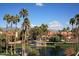 Aerial view of community with pond and landscaping at 9707 E Mountain View Rd # 2430, Scottsdale, AZ 85258