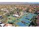 Aerial view of community with tennis courts, pool, and mountain backdrop at 9707 E Mountain View Rd # 2430, Scottsdale, AZ 85258