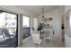 Dining area with glass table and chairs near balcony at 9707 E Mountain View Rd # 2430, Scottsdale, AZ 85258