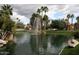 Serene lake with fountain and palm trees in a community setting at 9707 E Mountain View Rd # 2430, Scottsdale, AZ 85258