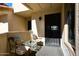 Private patio with wrought iron furniture and entrance to condo at 9707 E Mountain View Rd # 2430, Scottsdale, AZ 85258