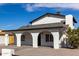 Property showcasing unique architecture with white columns, arches, and well-kept grounds at 124 E Beech Ave, Casa Grande, AZ 85122